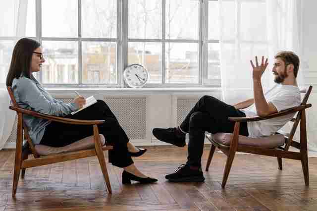 man speaking to a woman about difficult partner