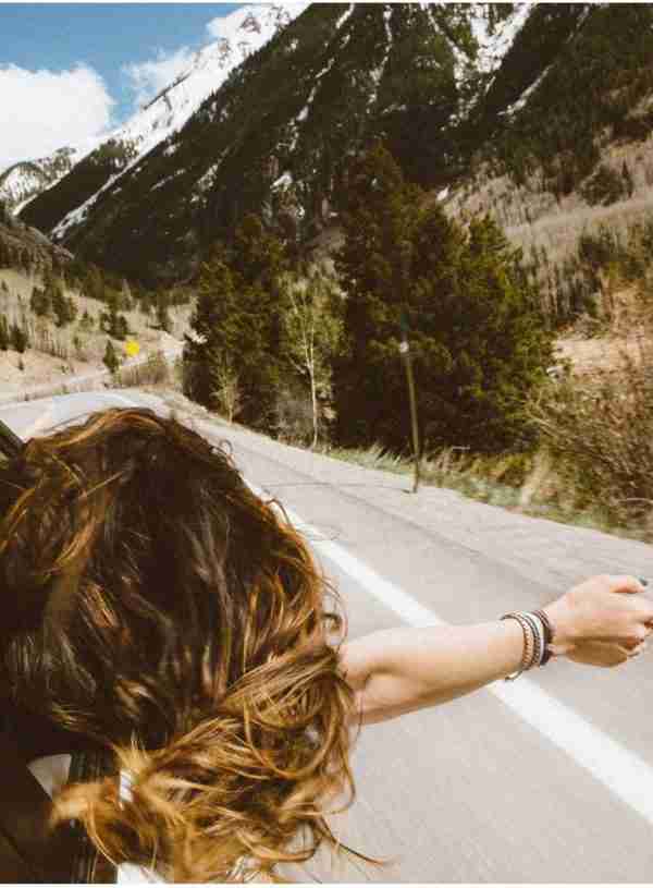 woman riding in a car facing forward