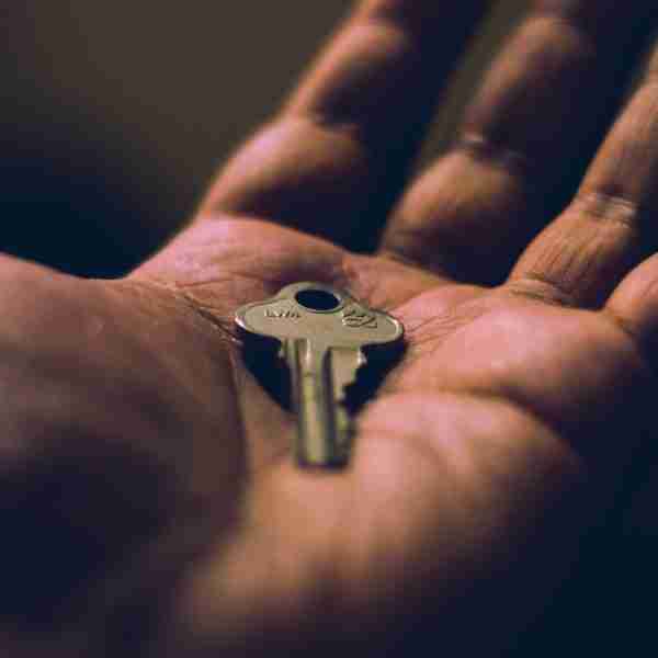holding a key in the palm of your hand