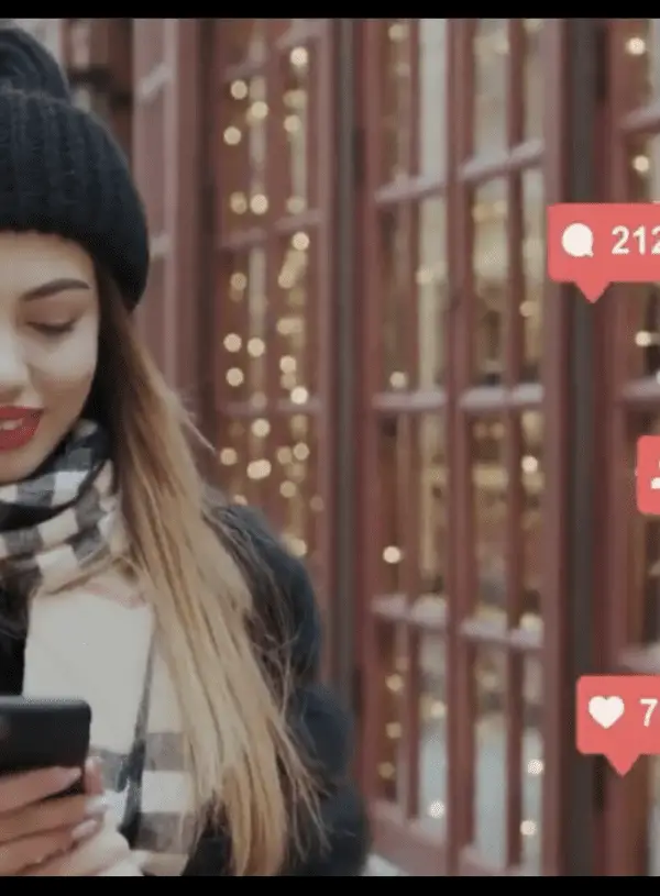Woman walking down the street checking likes