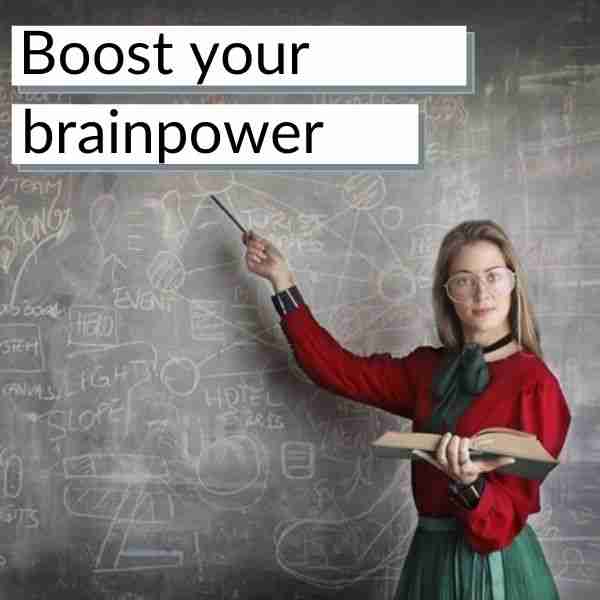 woman point to a chalk board covered in equations to boost your brainpower