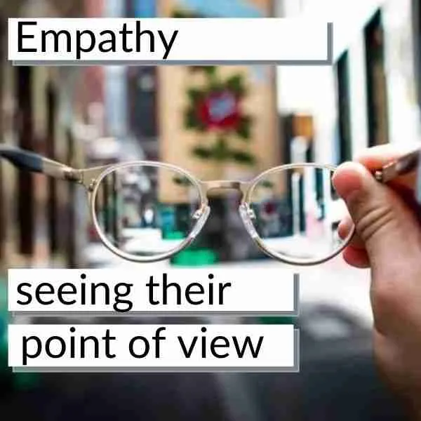 person holding glasses showing empathy as a point of view