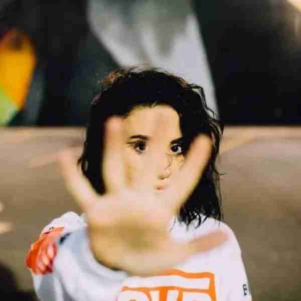 woman with hand out in a stop gesture emphasizing the benefits of saying no