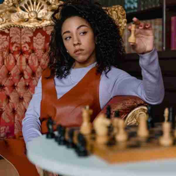 woman playing chess and mind games