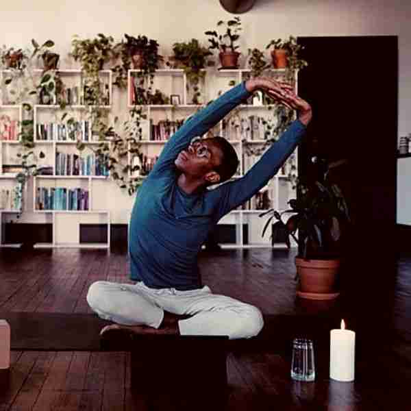 young man doing yoga as self-care