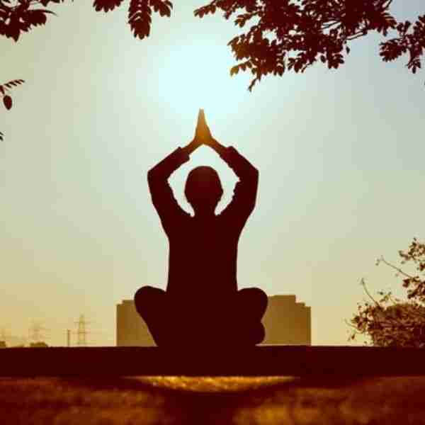 person in a yoga pose performing Gratitude Practice to Keep Your Thoughts Positive