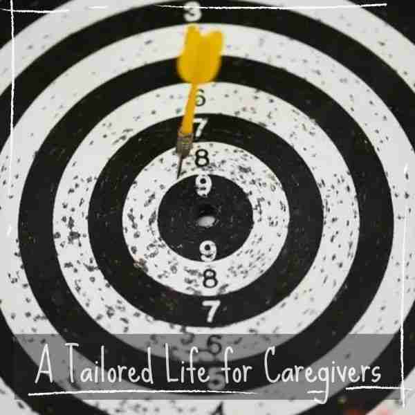 bullseye with a yellow dart in the middle showing how to create a self-coaching action plan