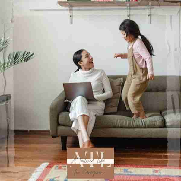 woman working on computer and playing with daughter symbolizing work life balance make time for fun