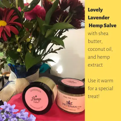 2 Jars of Lavender Hemp Salve next to woodland flowers