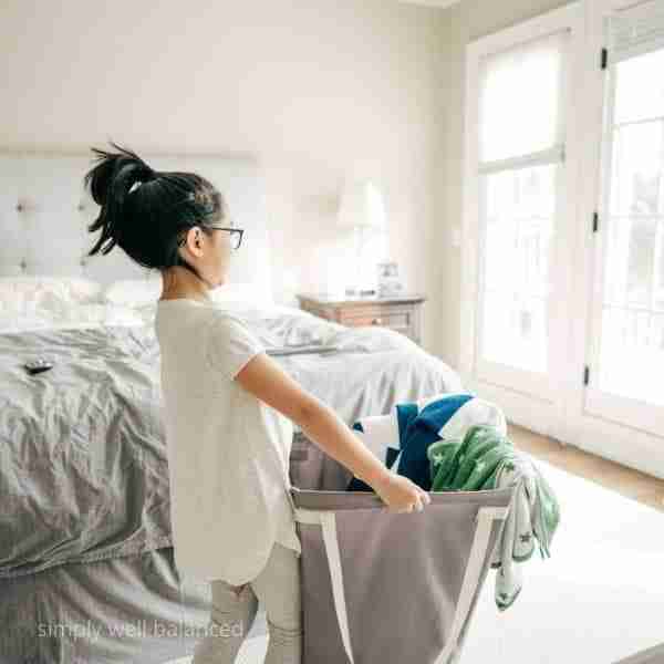 child doing laundry